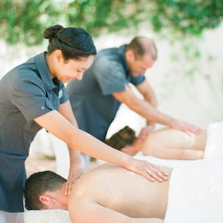 Couple enjoying a massage treatment together